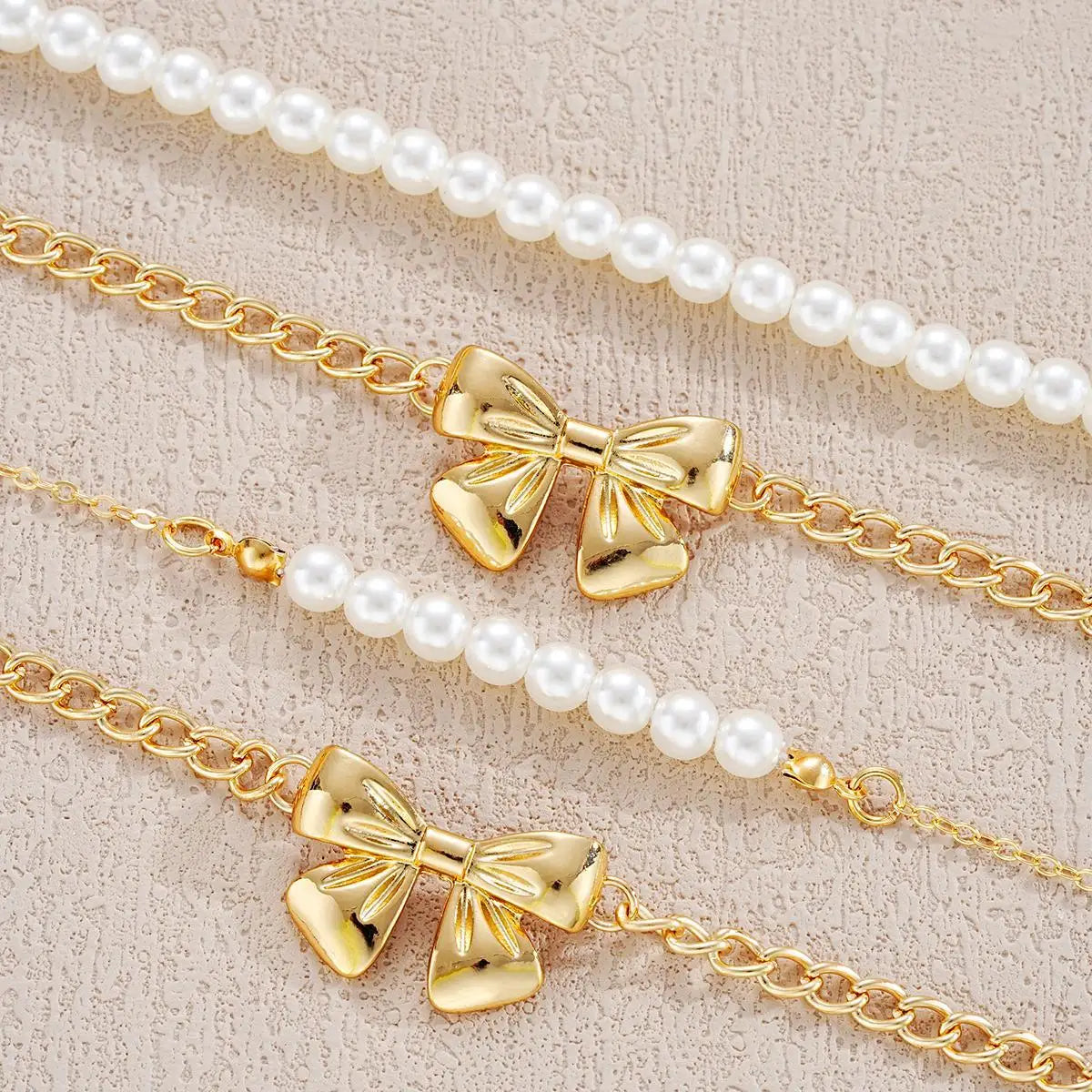 BRAC23 - Set di gioielli da donna con fiocco e perle