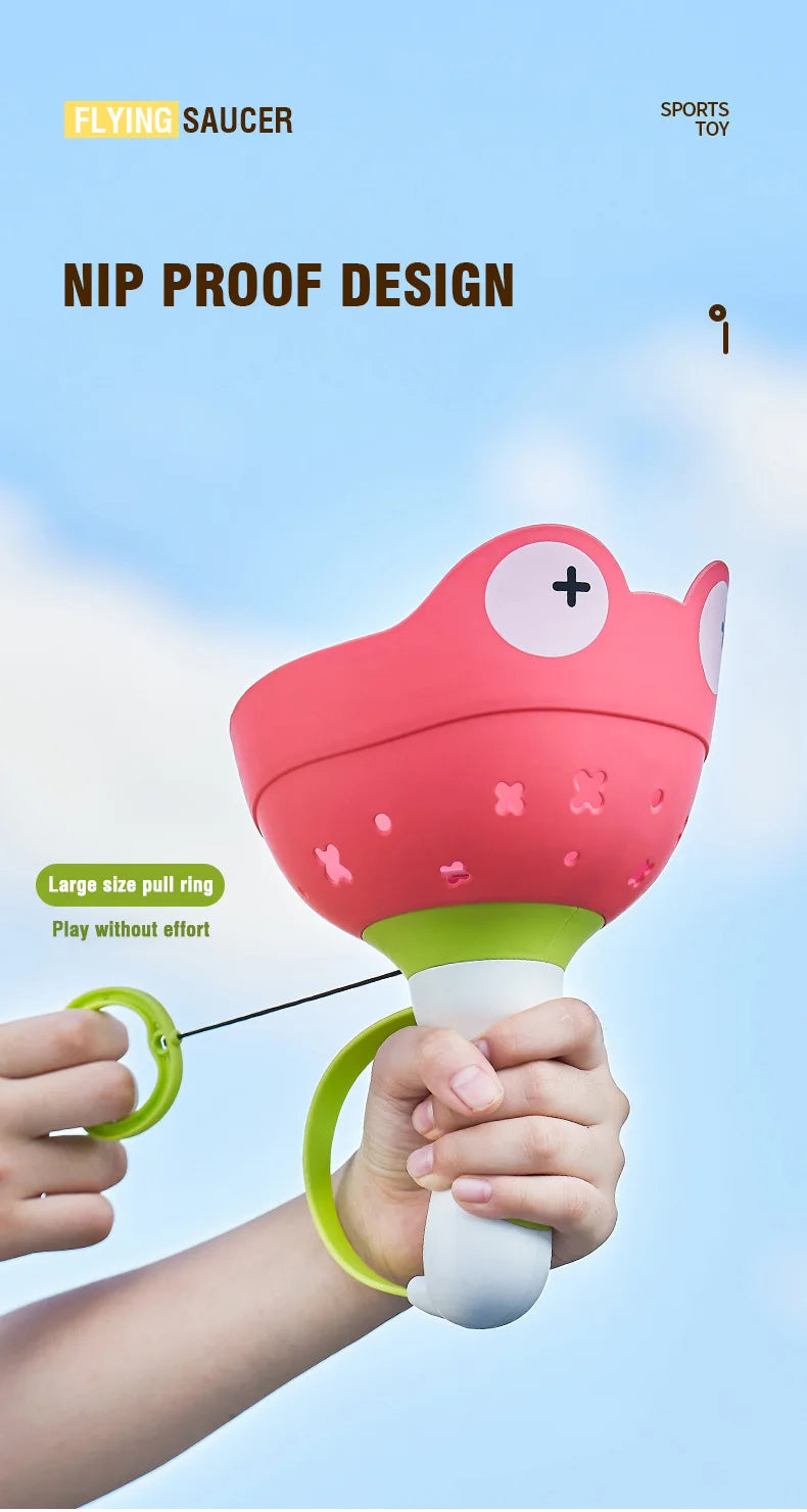 T15 - Kids Flying Saucer Disc Launcher Frog Catapult Flying Toys Pull String UFO