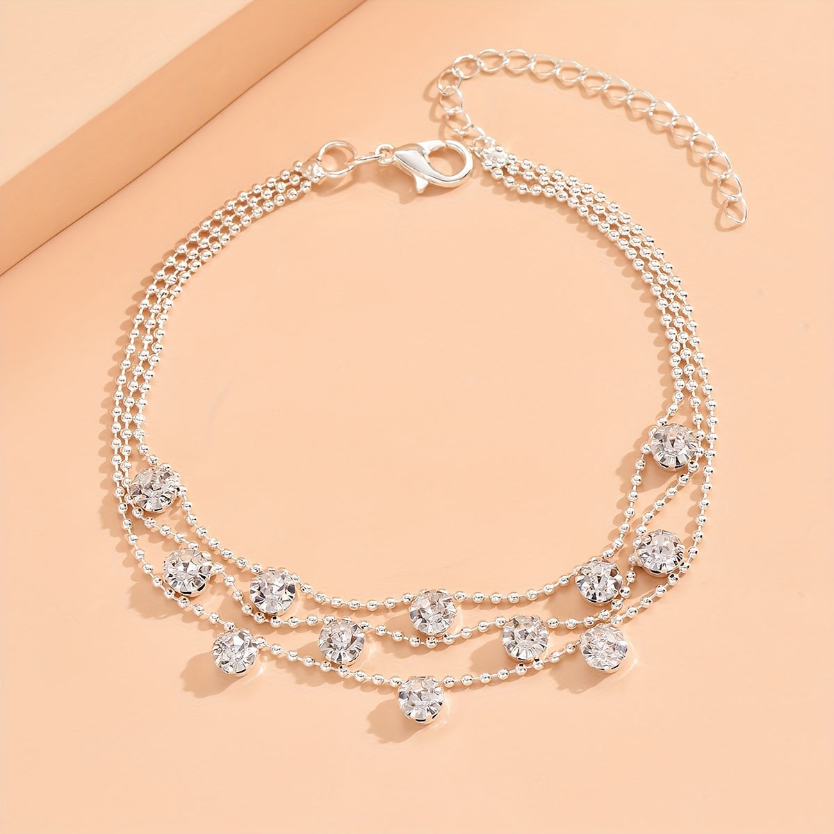 BRAC12 - Elegante cavigliera con triplo strato di strass