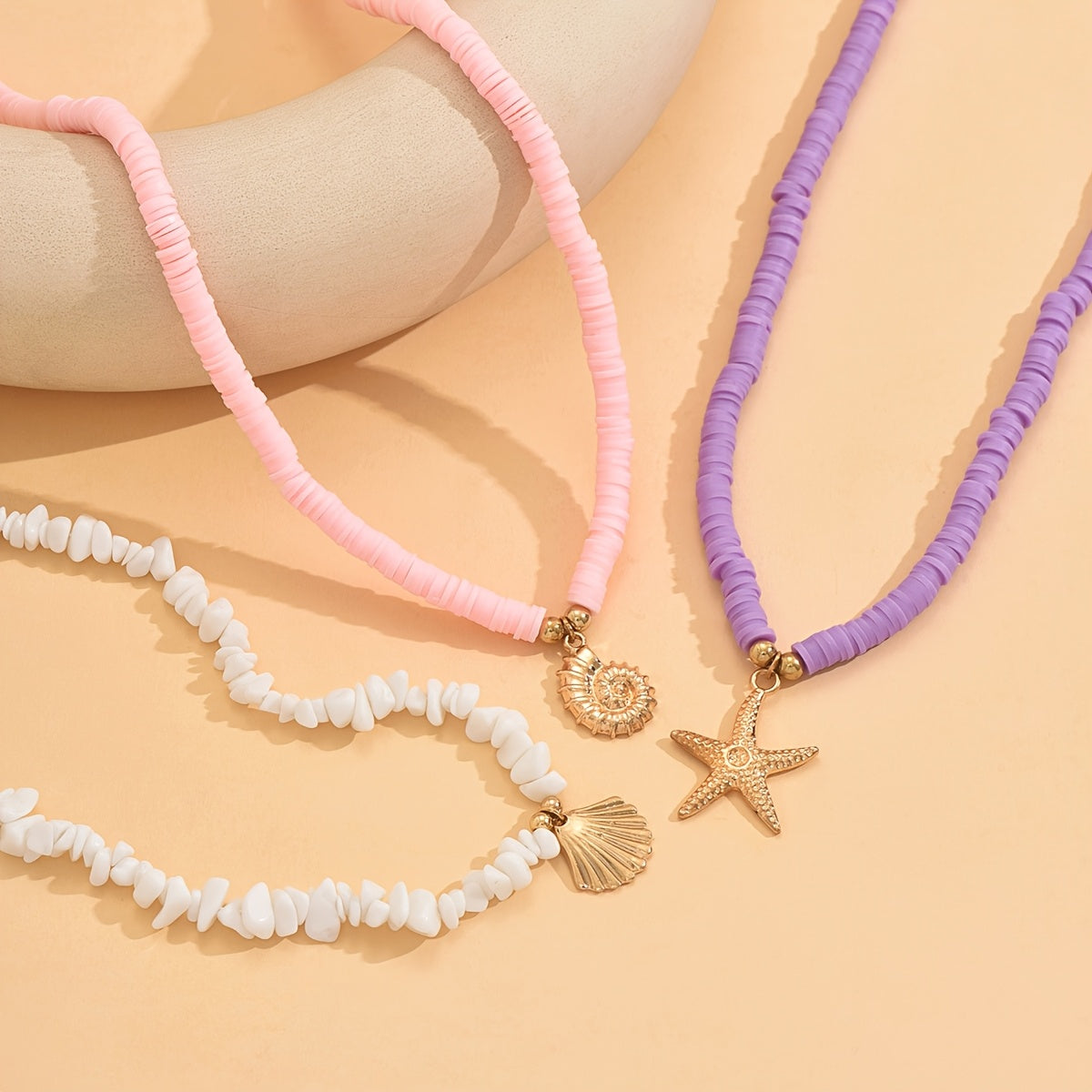 BRAC08 - 3 collane circolari in argilla con ciondolo tema marino