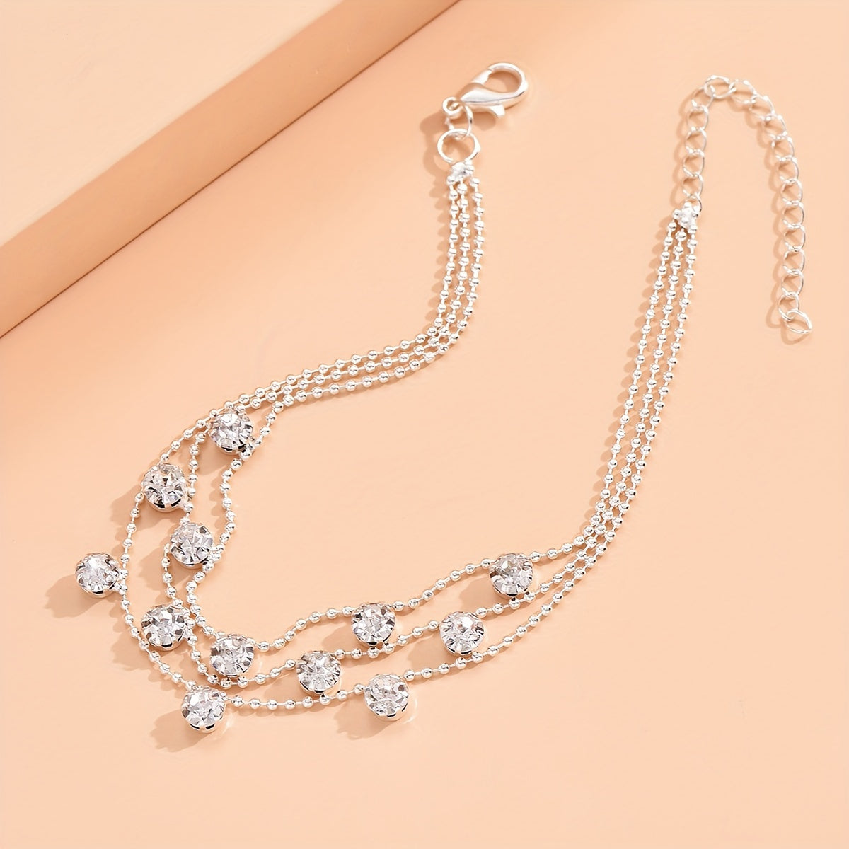 BRAC12 - Elegante cavigliera con triplo strato di strass