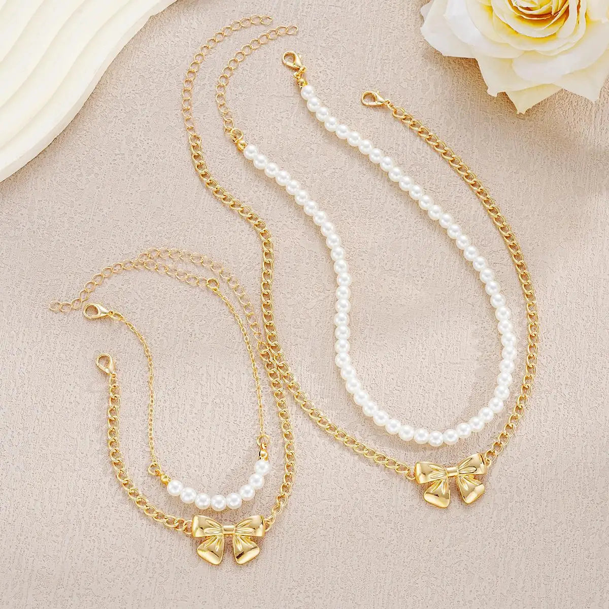 BRAC23 - Set di gioielli da donna con fiocco e perle