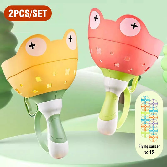 T15 - Kids Flying Saucer Disc Launcher Frog Catapult Flying Toys Pull String UFO